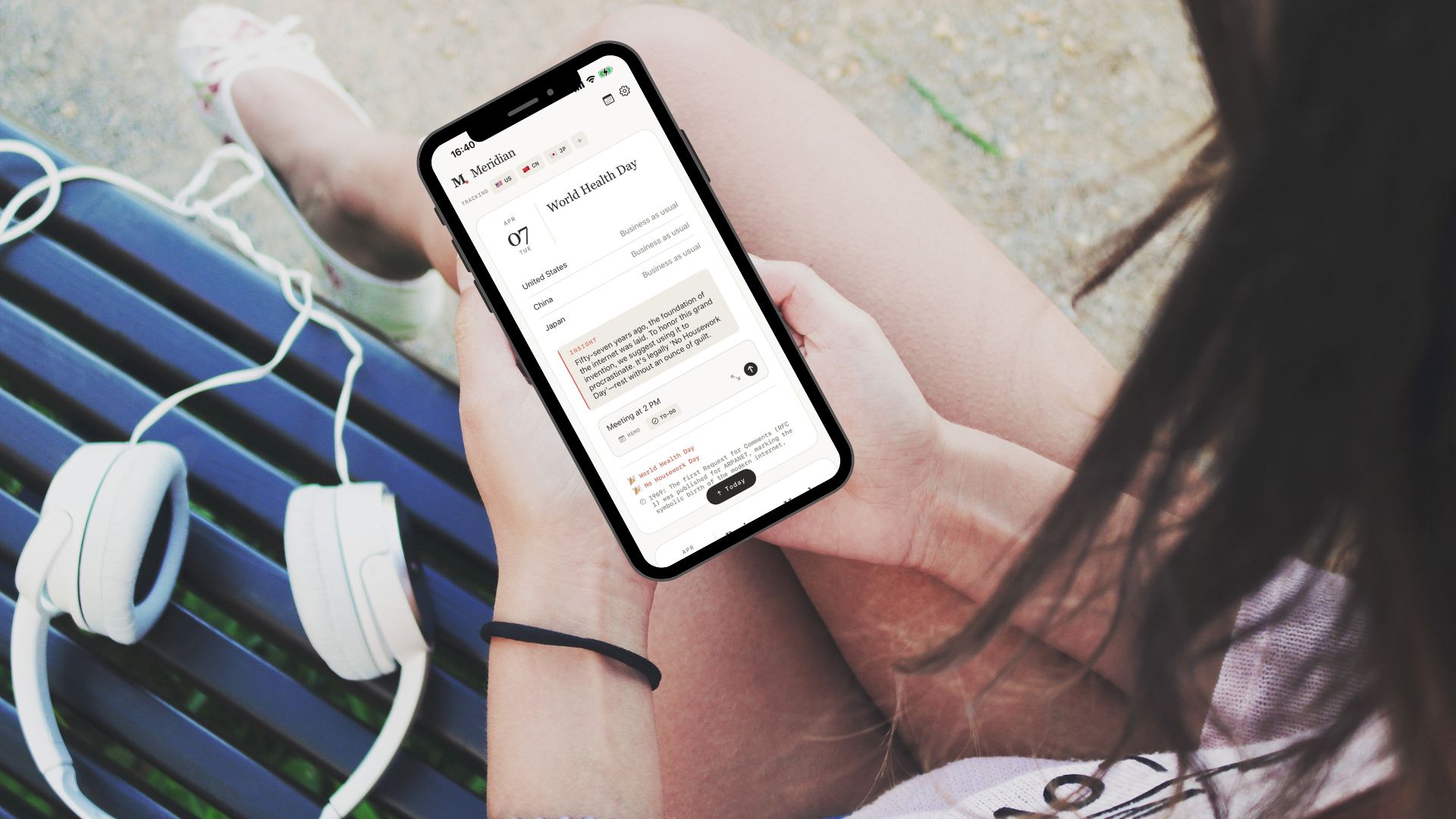 A person browsing the Meridian app on their phone outdoors
